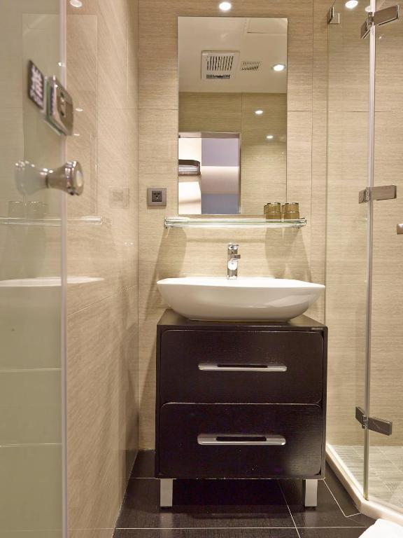 a bathroom with a sink and a shower at Beauty Hotels Taipei - Hotel B7 in Taipei