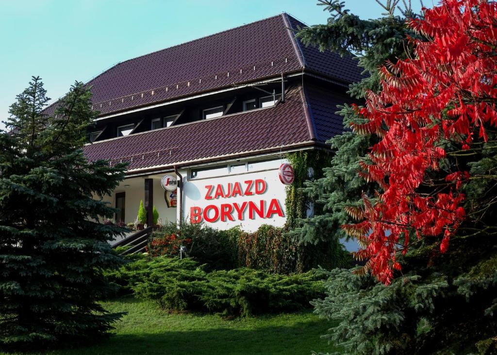 a building with a sign that reads kairdneauoya at Zajazd Boryna in Wieluń