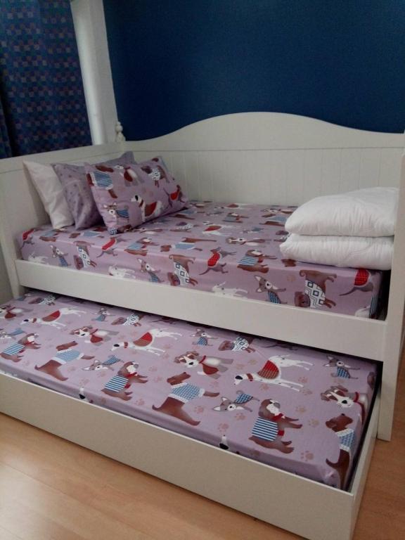 Postel nebo postele na pokoji v ubytování BaanSu Hostel