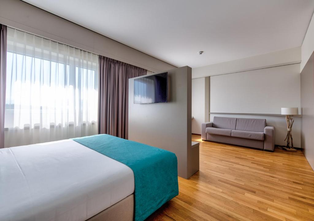 Postel nebo postele na pokoji v ubytování Aquatis Hotel