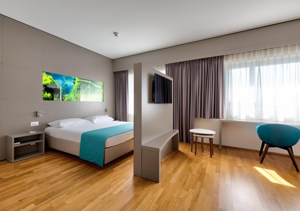 Postel nebo postele na pokoji v ubytování Aquatis Hotel