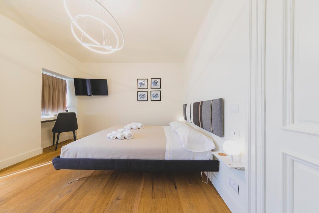 Łóżko lub łóżka w pokoju w obiekcie Cefalù Design Suites