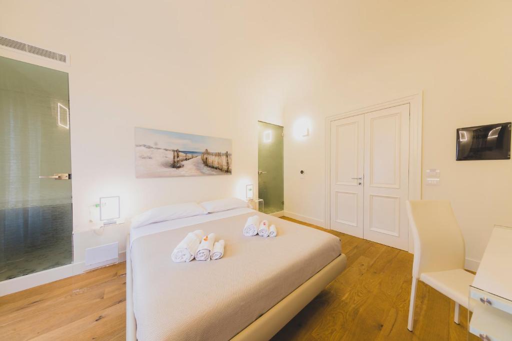 Łóżko lub łóżka w pokoju w obiekcie Cefalù Design Suites