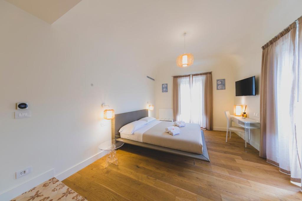 Łóżko lub łóżka w pokoju w obiekcie Cefalù Design Suites