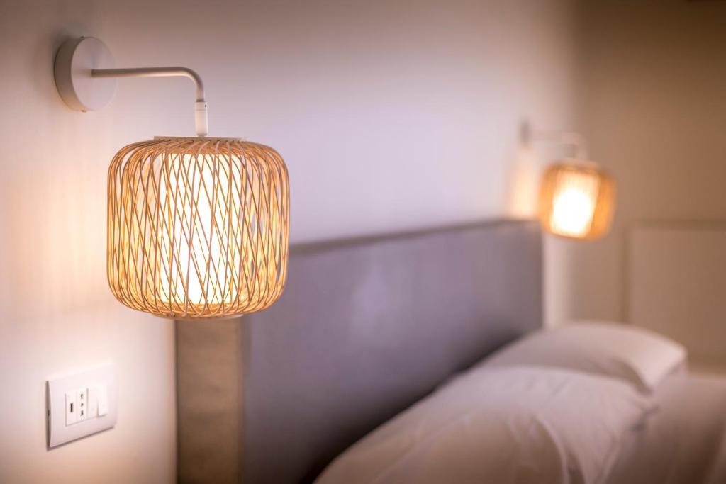 Łóżko lub łóżka w pokoju w obiekcie Cefalù Design Suites