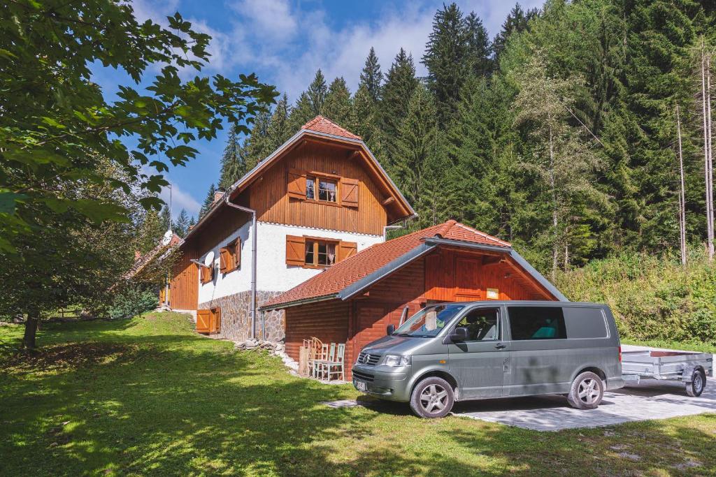 a van parked in front of a house at POHORJE HOUSE Rogla 2 in Oplotnica