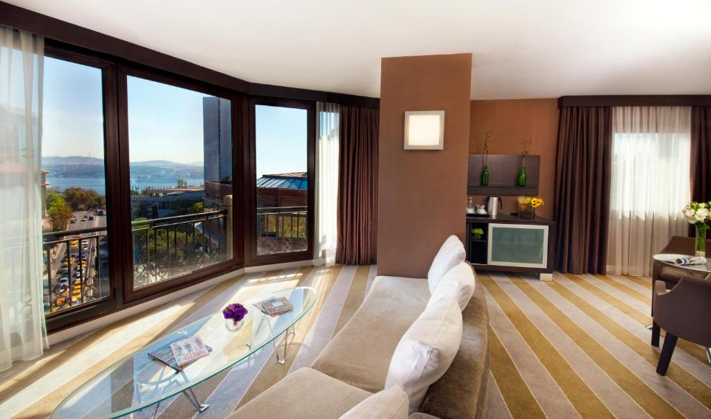 a living room with a view of a building at Point Hotel Taksim in Istanbul