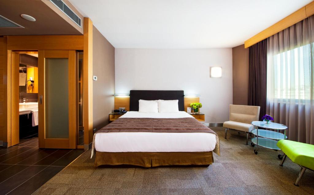 a hotel room with a bed and a bathroom at Point Hotel Taksim in Istanbul