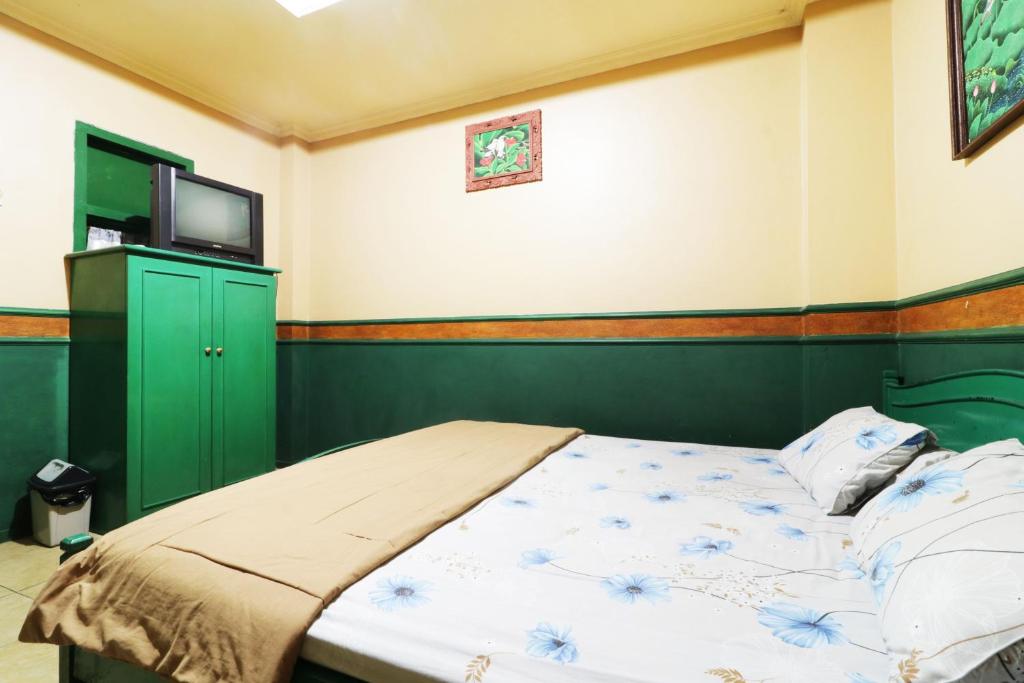 Postel nebo postele na pokoji v ubytování Hotel Alamanda