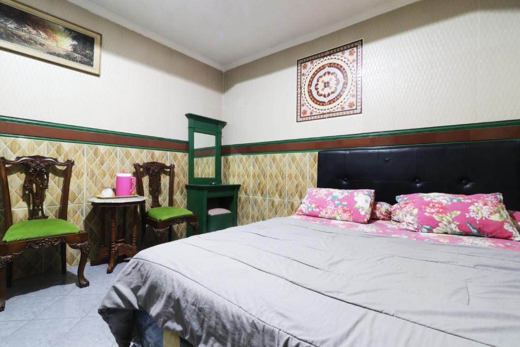 Postel nebo postele na pokoji v ubytování Hotel Alamanda