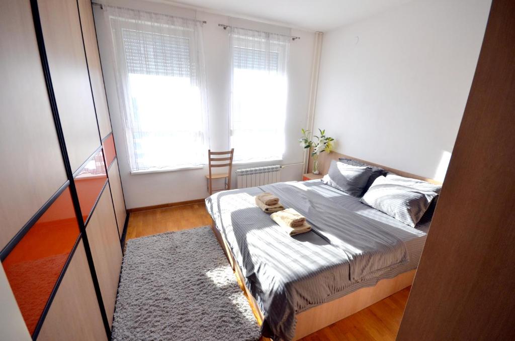 Postel nebo postele na pokoji v ubytování Clean&Cozy Apartments Novi Beograd