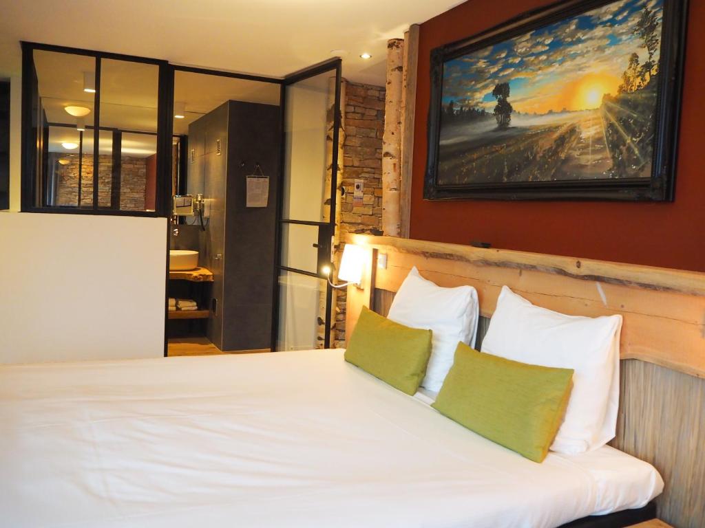 Postel nebo postele na pokoji v ubytování Boutique Hotel, Restaurant & Wellness Westerburcht