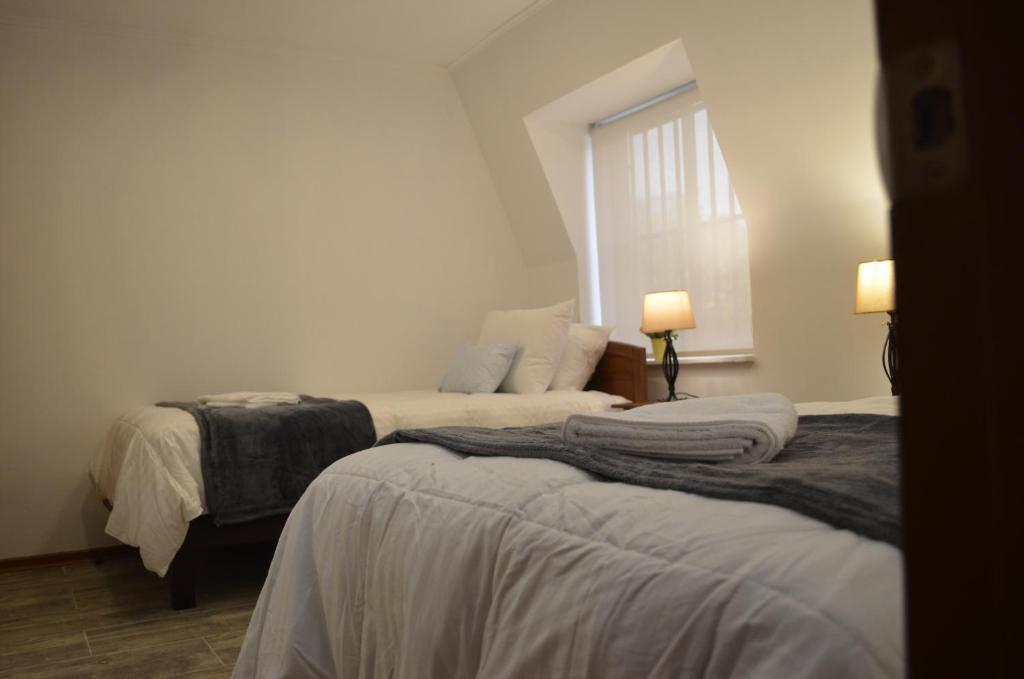 Uma cama ou camas num quarto em Los Araucanos