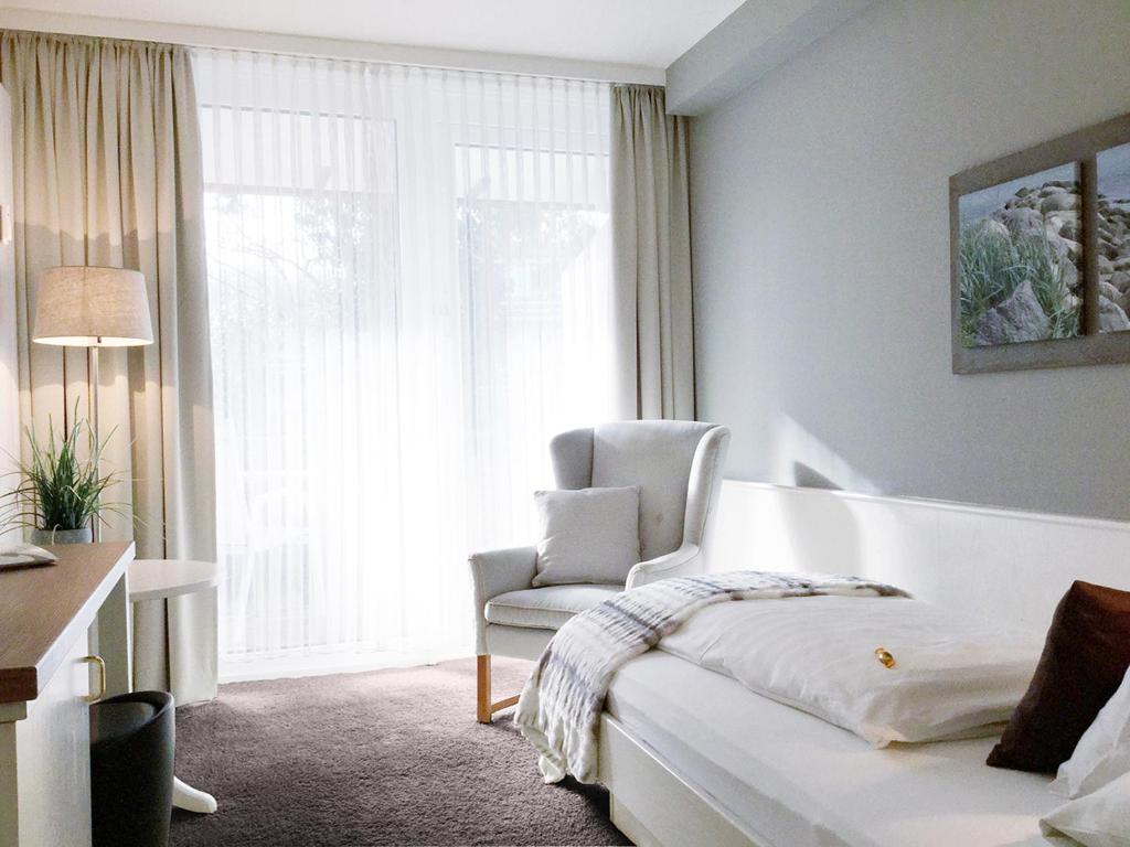 Postel nebo postele na pokoji v ubytování Hotel Ancora