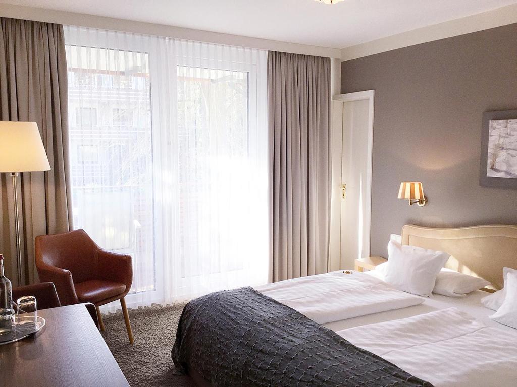 Postel nebo postele na pokoji v ubytování Hotel Ancora