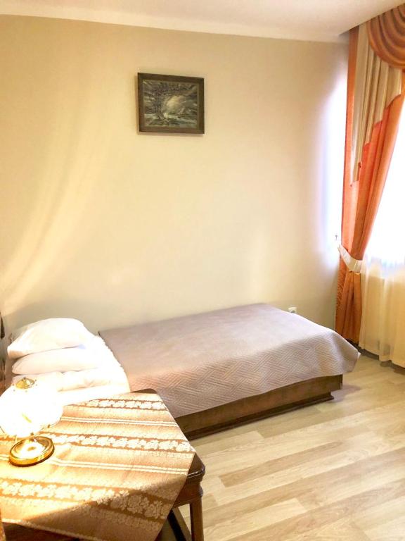 Postel nebo postele na pokoji v ubytování Atlant Hotel