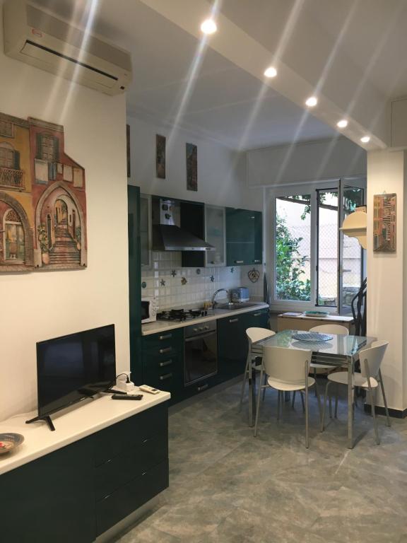 a kitchen with a table and chairs and a dining room at Bilocale alle 5 Terre Monterosso 200m from the beach in Monterosso al Mare
