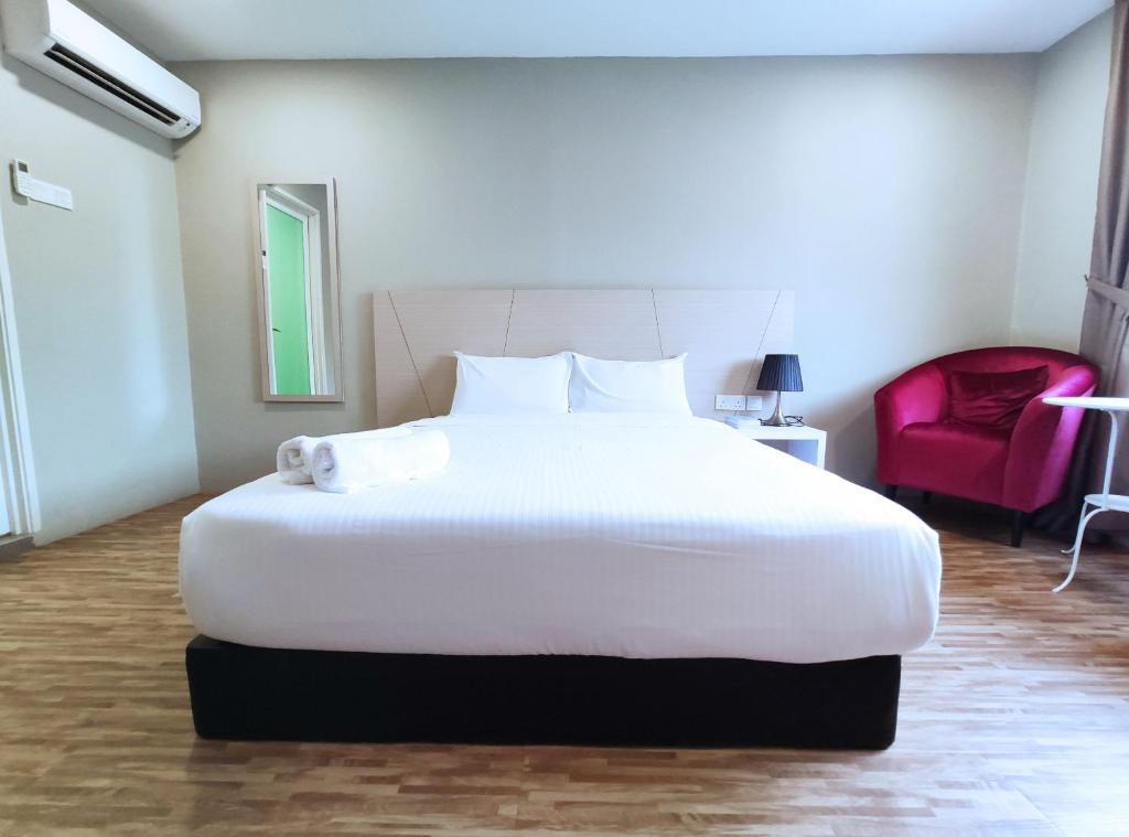 Postel nebo postele na pokoji v ubytování Princess Hotel Pontian