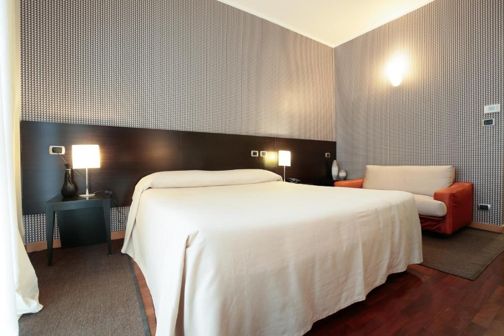Postel nebo postele na pokoji v ubytování Hotel Aleramo