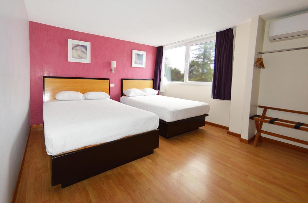 Postel nebo postele na pokoji v ubytování Centro 19 Hotel