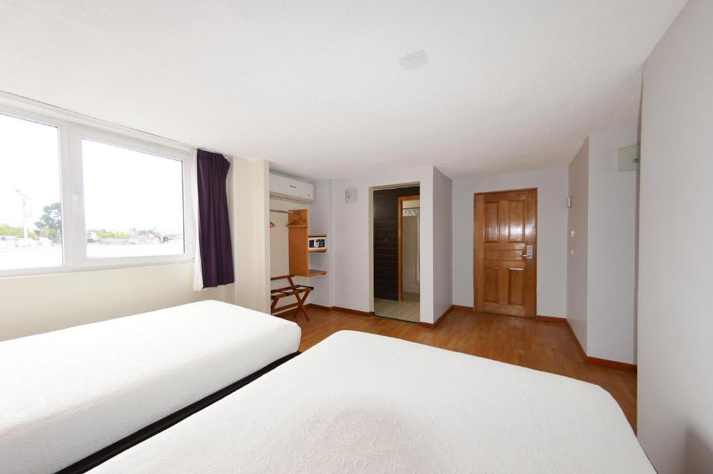 Postel nebo postele na pokoji v ubytování Centro 19 Hotel