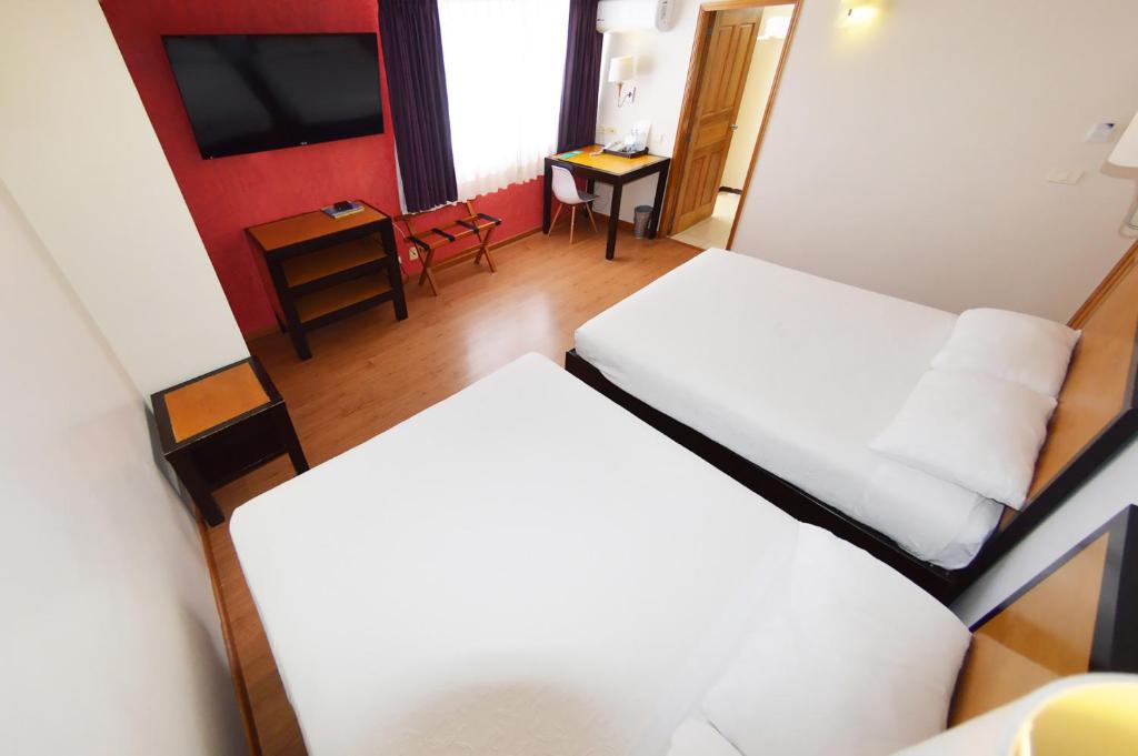 Postel nebo postele na pokoji v ubytování Centro 19 Hotel