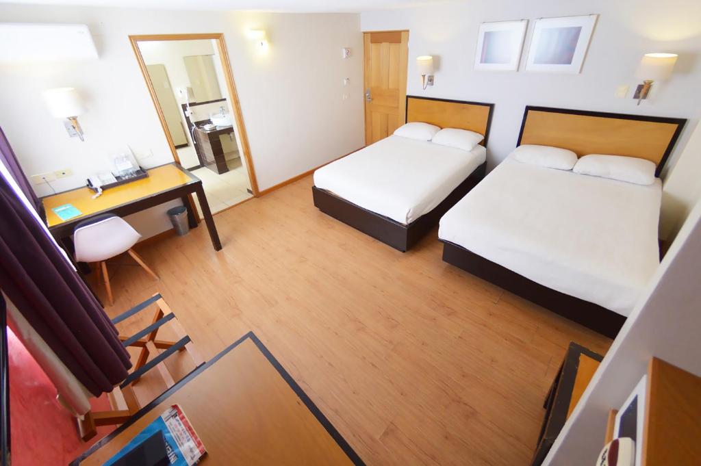 Postel nebo postele na pokoji v ubytování Centro 19 Hotel