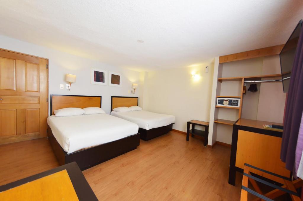Postel nebo postele na pokoji v ubytování Centro 19 Hotel