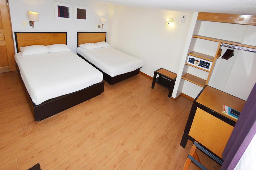 Postel nebo postele na pokoji v ubytování Centro 19 Hotel