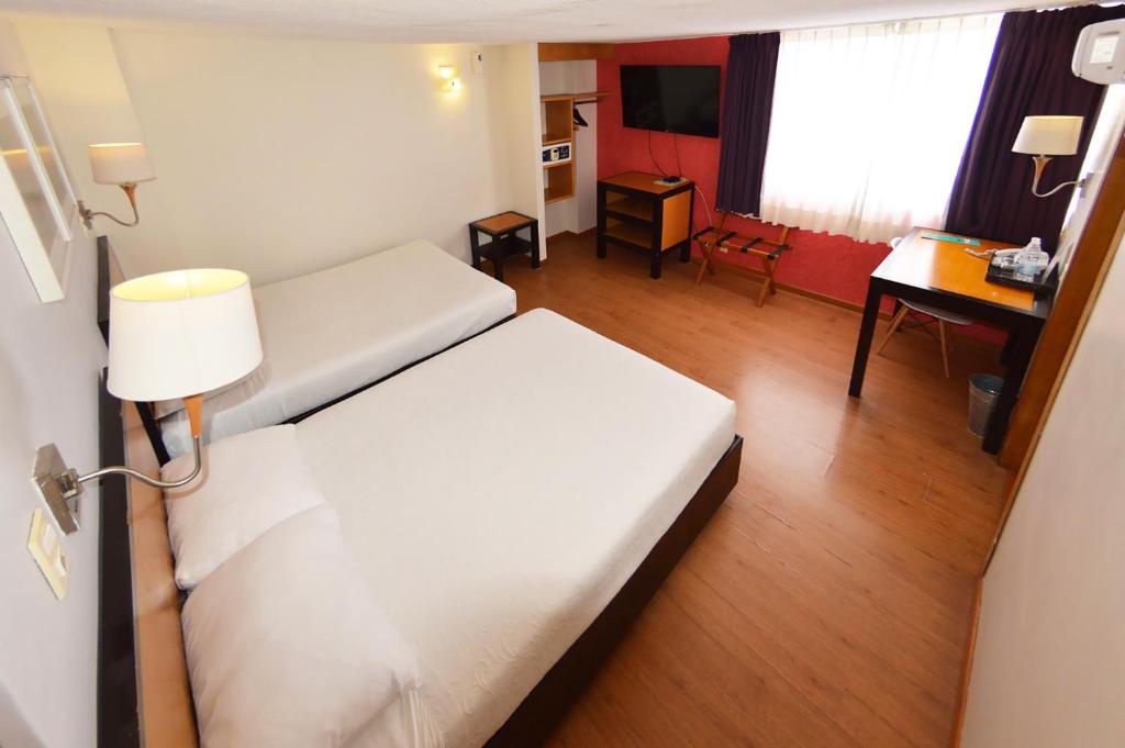Postel nebo postele na pokoji v ubytování Centro 19 Hotel