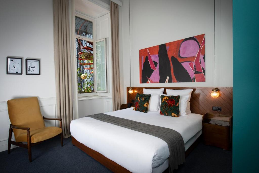 Postel nebo postele na pokoji v ubytování Communal Hotel Sololaki