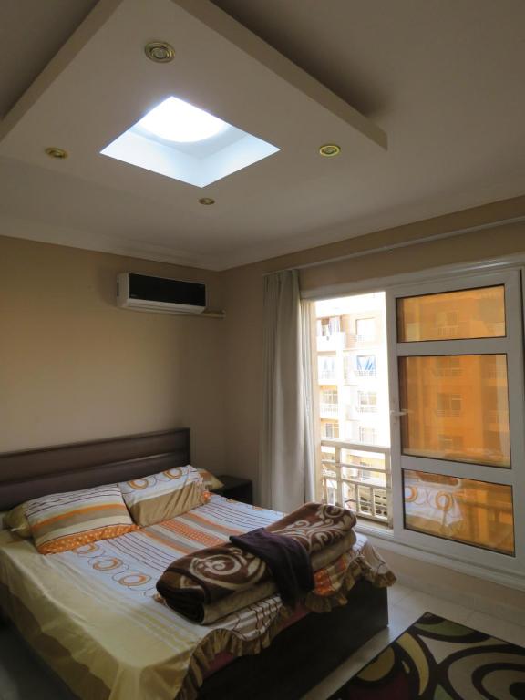 Ένα ή περισσότερα κρεβάτια σε δωμάτιο στο Gazzar inn Madinaty 25