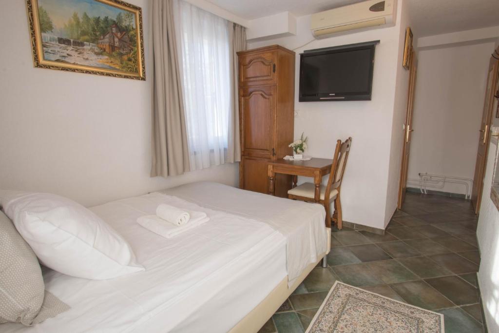 Postel nebo postele na pokoji v ubytování Jagodic Garni Hotel