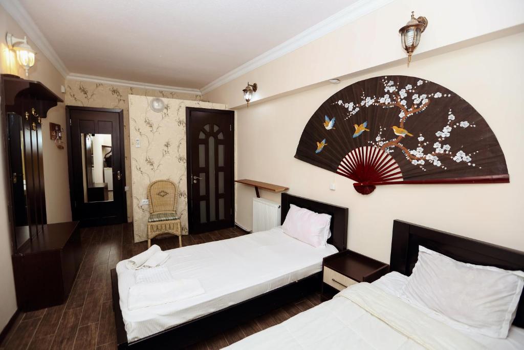Postel nebo postele na pokoji v ubytování Hotel Isaka