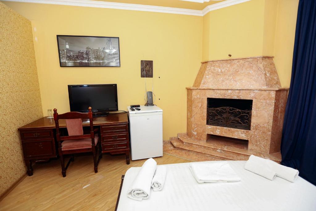 TV a/nebo společenská místnost v ubytování Hotel Isaka