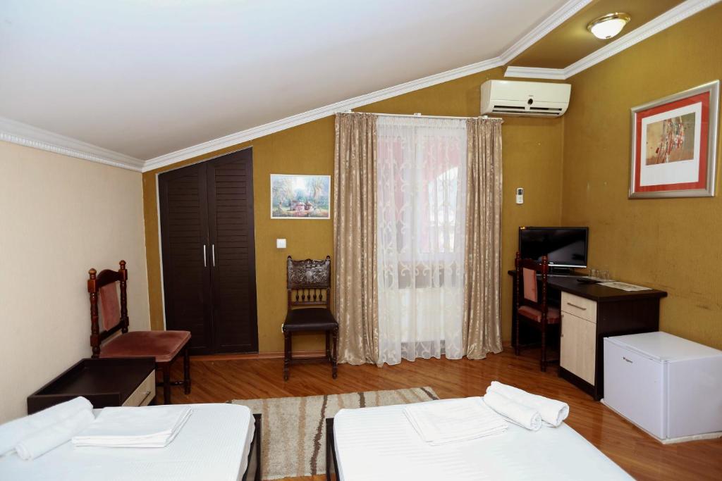 Postel nebo postele na pokoji v ubytování Hotel Isaka