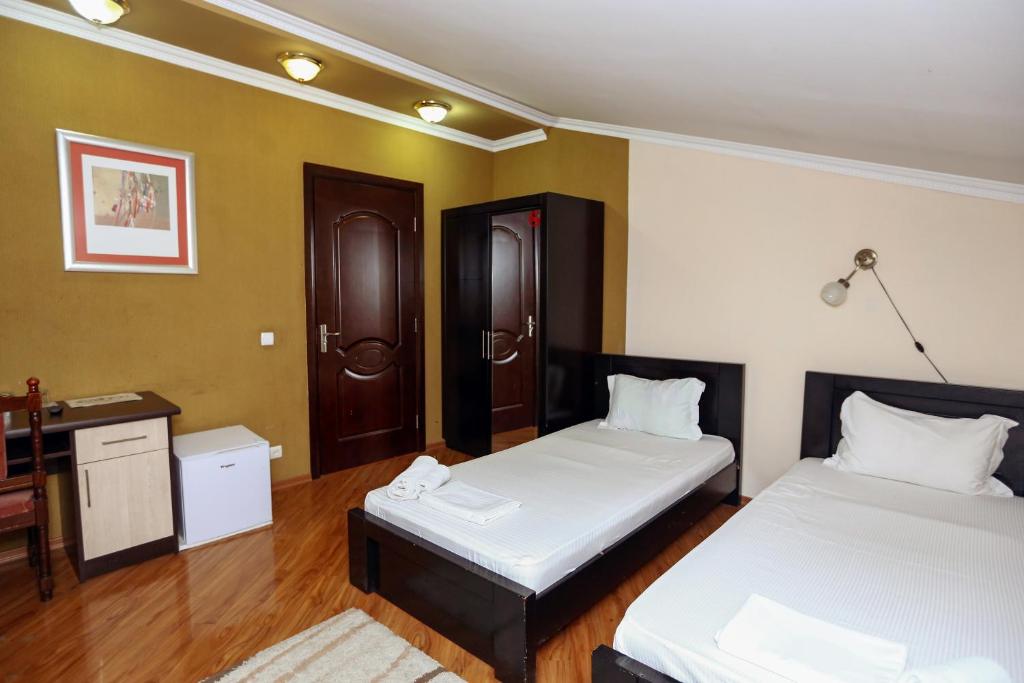 Postel nebo postele na pokoji v ubytování Hotel Isaka