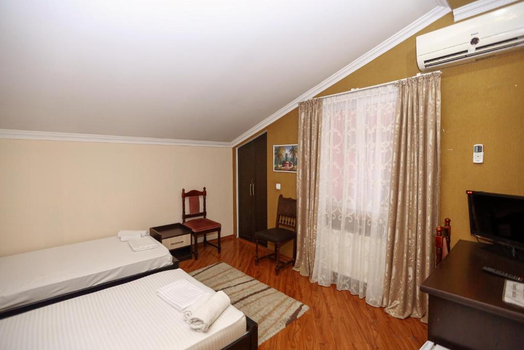 Postel nebo postele na pokoji v ubytování Hotel Isaka