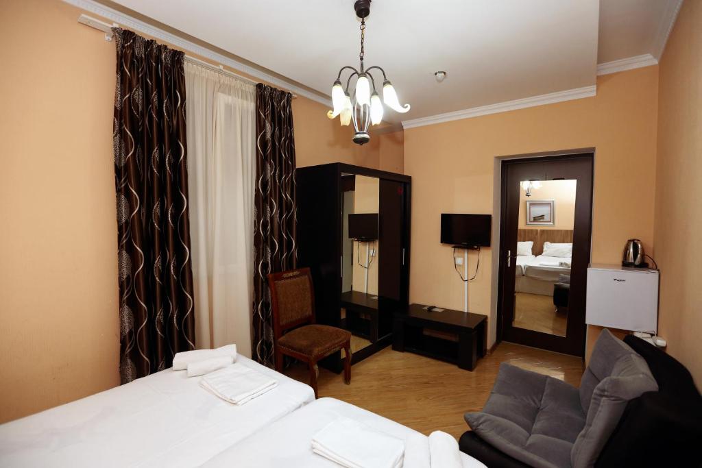 Postel nebo postele na pokoji v ubytování Hotel Isaka