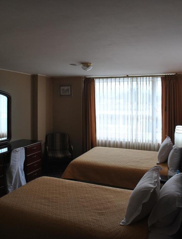Postel nebo postele na pokoji v ubytování Hotel Makroz