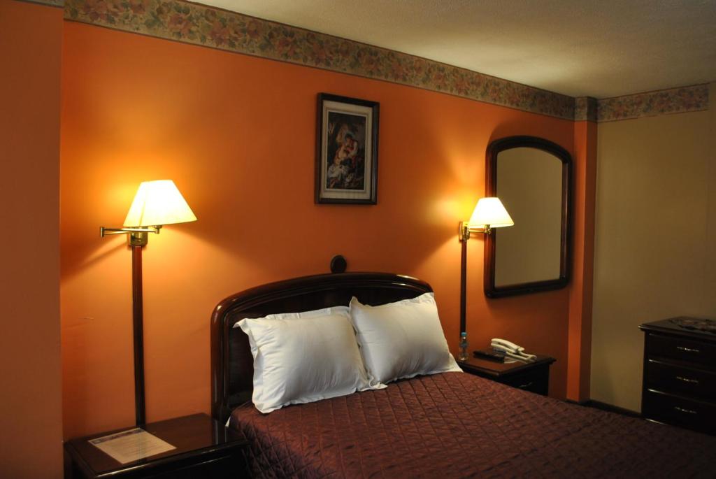 Postel nebo postele na pokoji v ubytování Hotel Makroz
