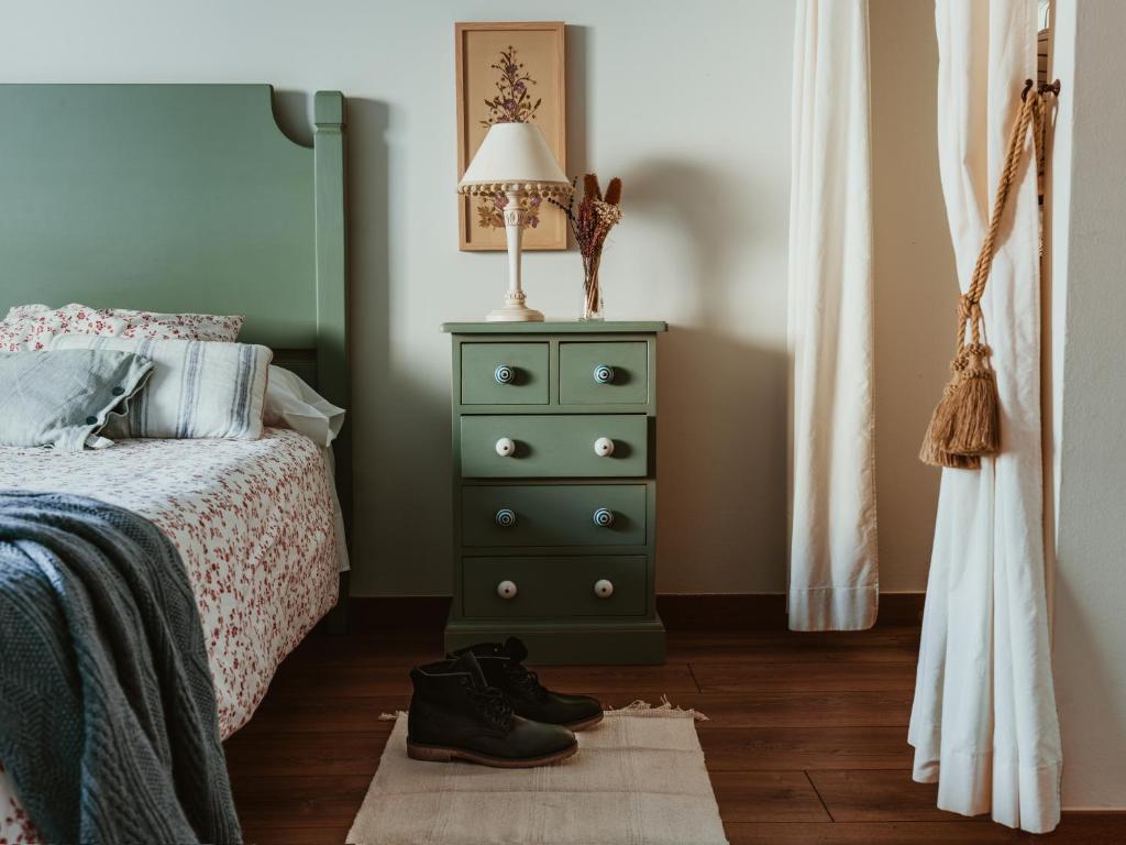 Cama o camas de una habitación en Hospedería del Valle Boutique Apartments