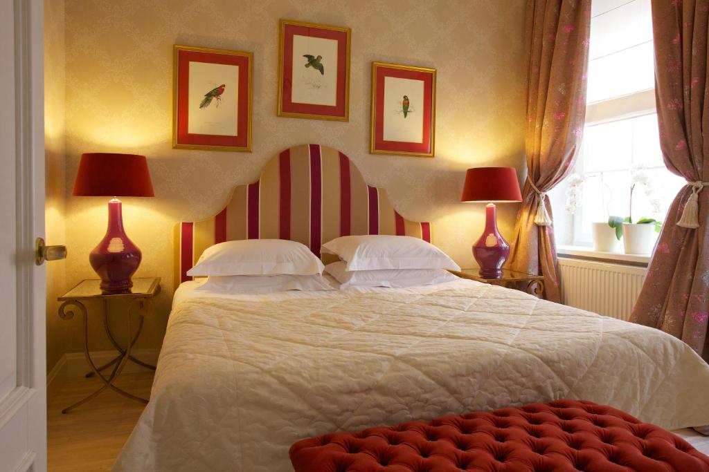 Postel nebo postele na pokoji v ubytování Hotel Apia