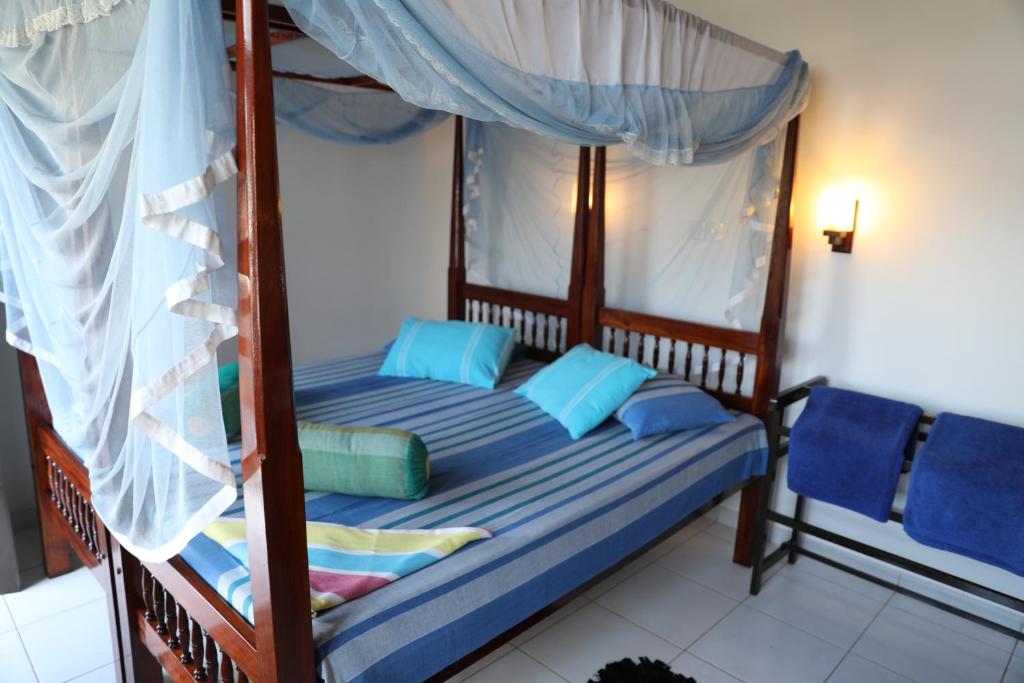 Voodi või voodid majutusasutuse Main Reef Guest House toas