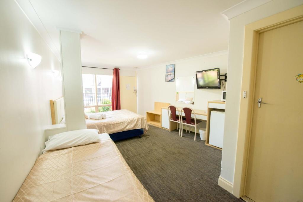Postel nebo postele na pokoji v ubytování Jacksons Motor Inn