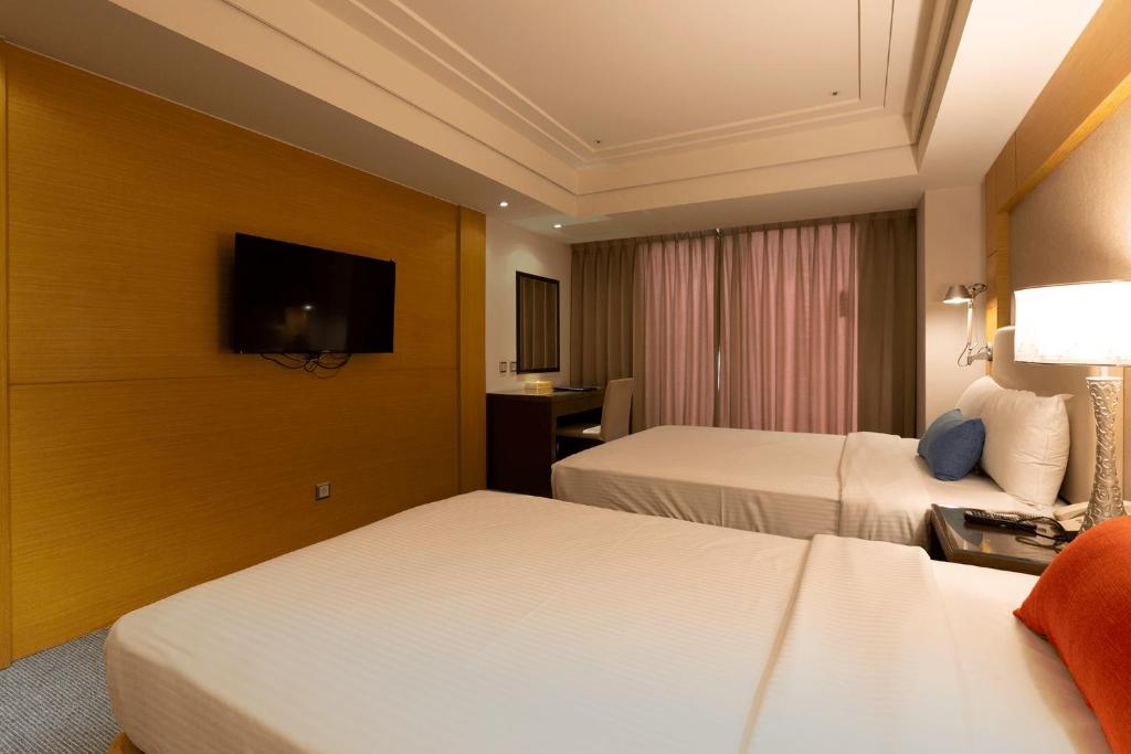 TV a/nebo společenská místnost v ubytování Ever Delightful Business Hotel