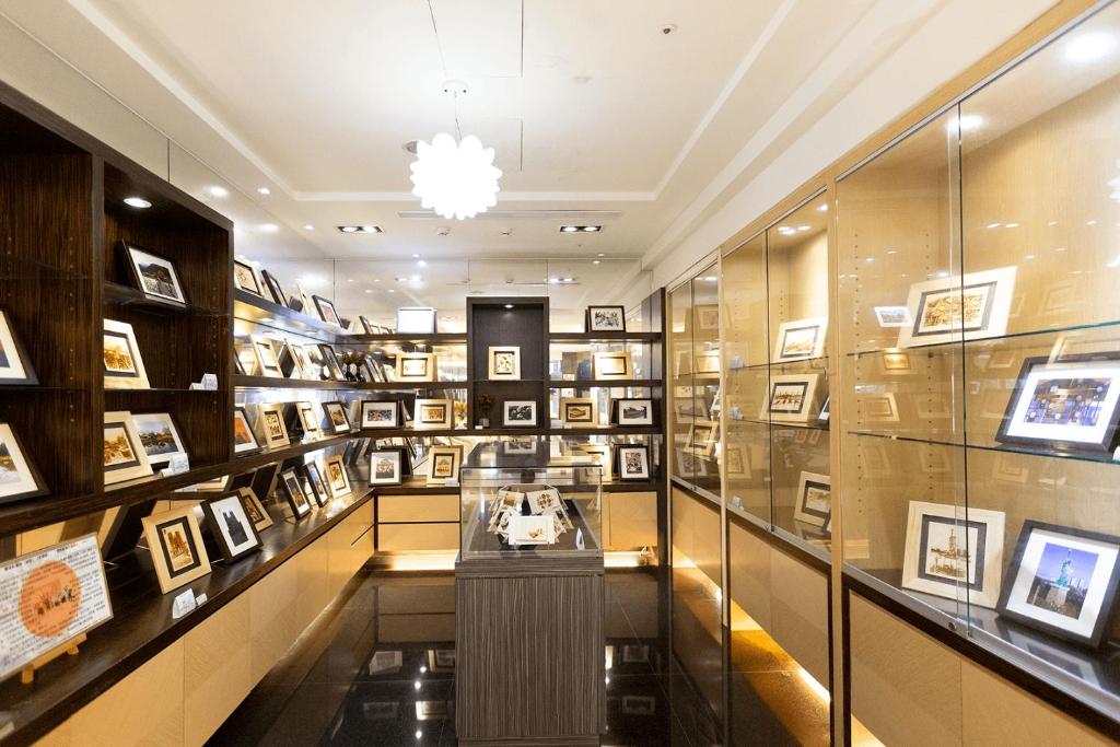 a display case in a museum with framed photographs at Ever Delightful Business Hotel in Chiayi City