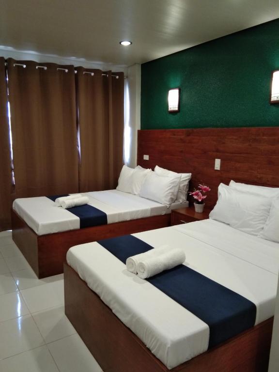 Cama o camas de una habitación en A&A ABE BAYFRONT INN