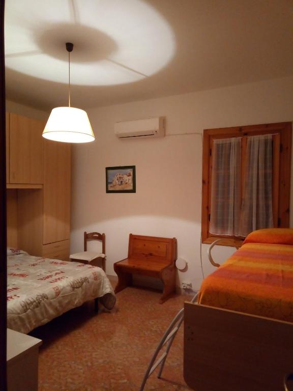 Postel nebo postele na pokoji v ubytování Villa Itaca
