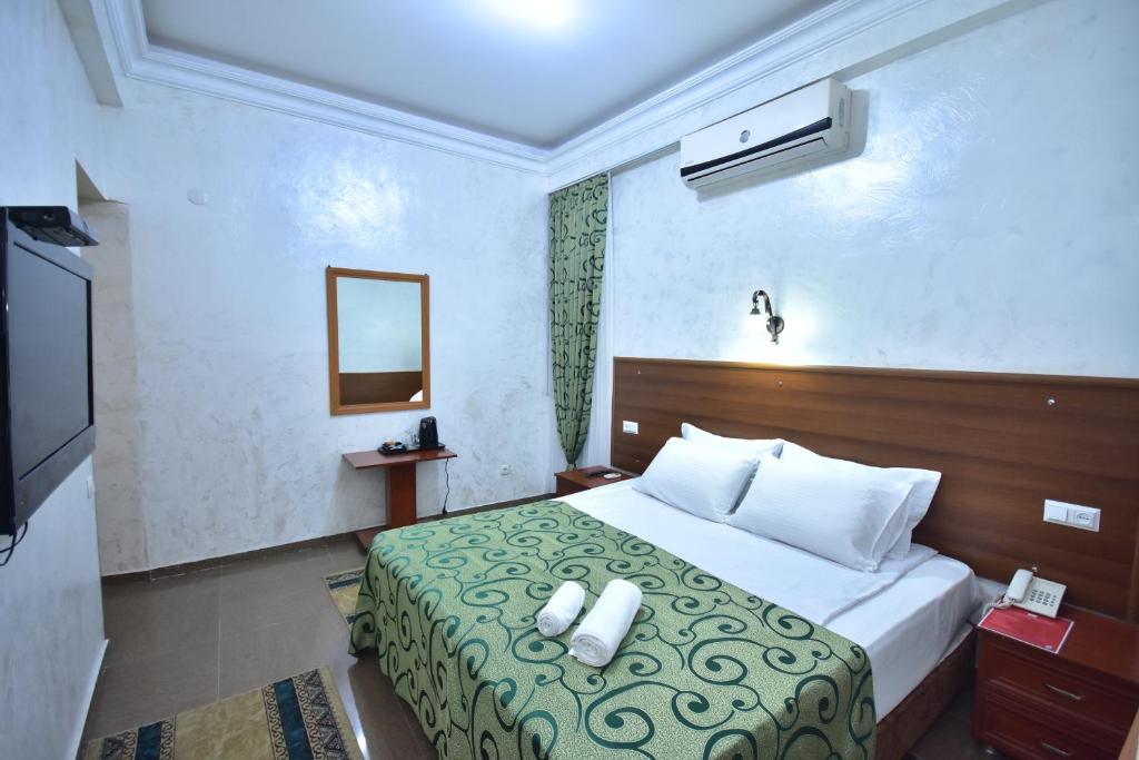 Postel nebo postele na pokoji v ubytování Hotel Chao